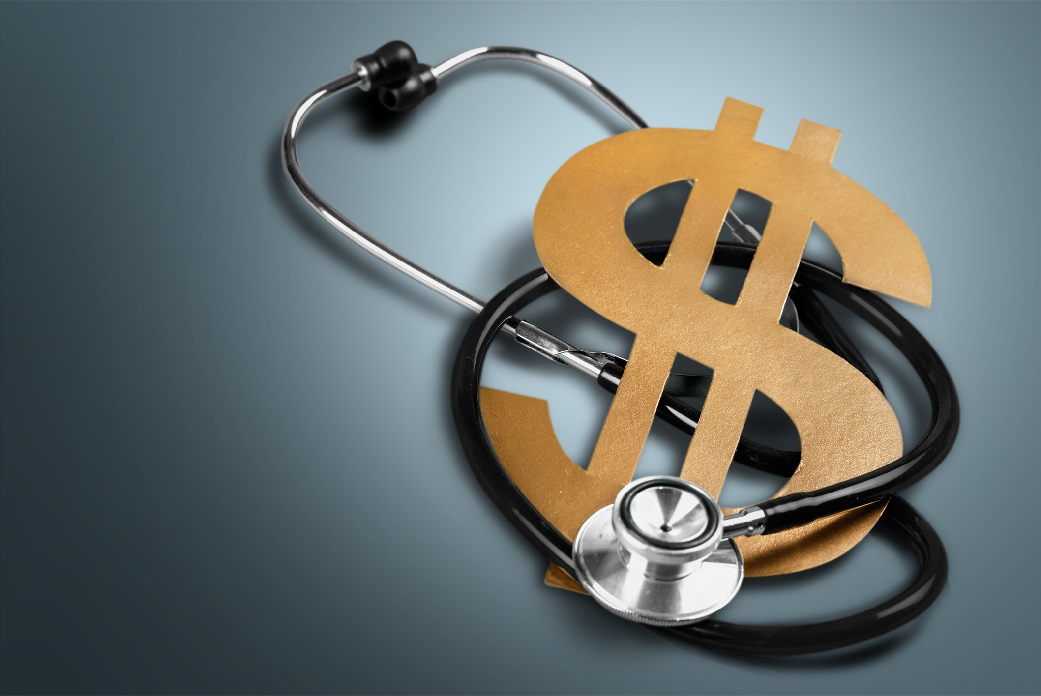 Stethoscope with a dollar sign to denote financial health